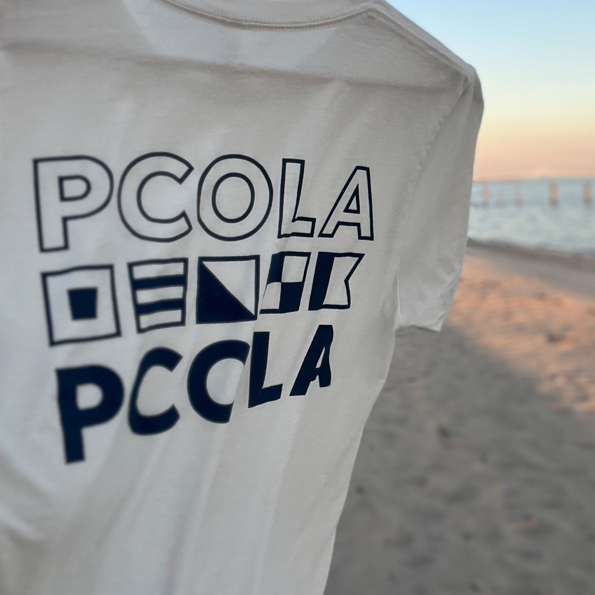 Adult PCOLA t-shirt made with soft fabric, featuring a bold Pensacola design, ideal for adults who love coastal style. 