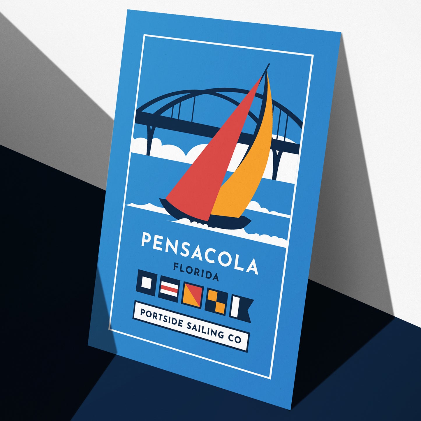 Portside Sailing Co. artistic poster featuring a sailboat in front of the Three-Mile Bridge on Pensacola Bay, perfect for sailing enthusiasts and coastal decor.
