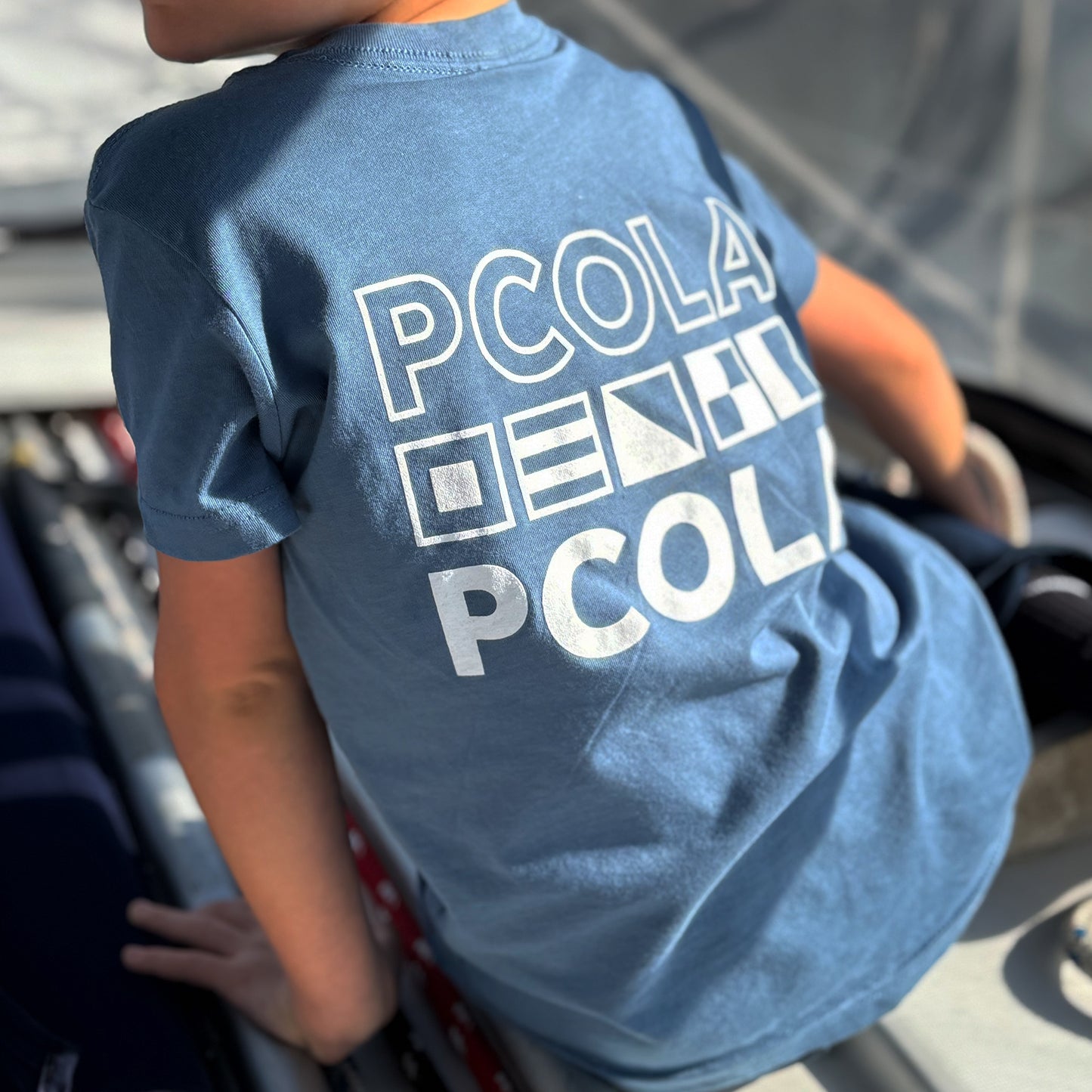 Premium kids' t-shirt featuring the 'PCOLA' design, showcasing Pensacola, FL in a stylish and comfortable fit for young adventurers.