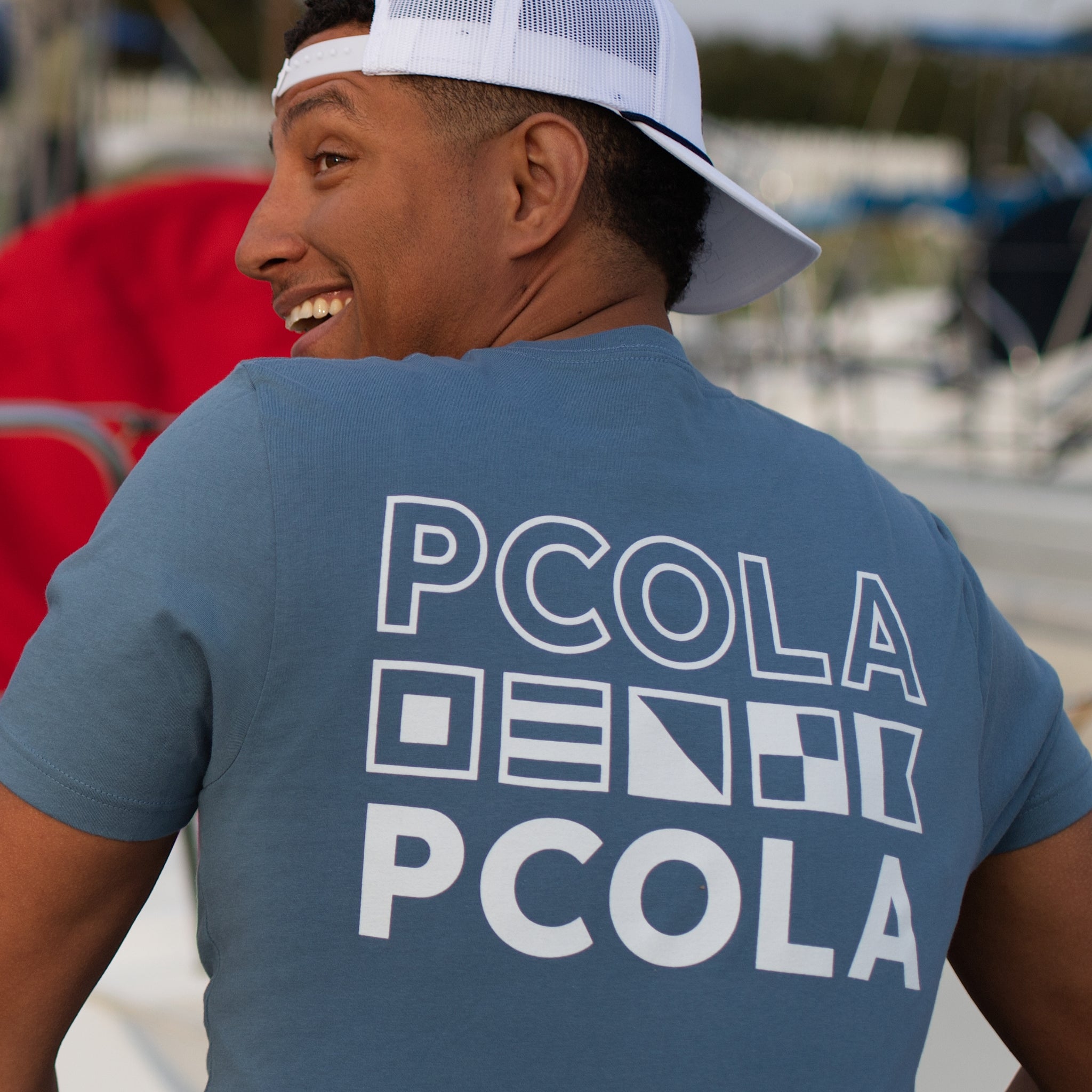 High-quality adult t-shirt with the 'PCOLA' design, perfect for those who love Pensacola and want to wear their hometown with pride.