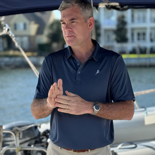 Elegant Portside Sailing Co. luxury polo shirt, made from soft, breathable fabric and featuring a refined embroidered logo for a stylish coastal look.