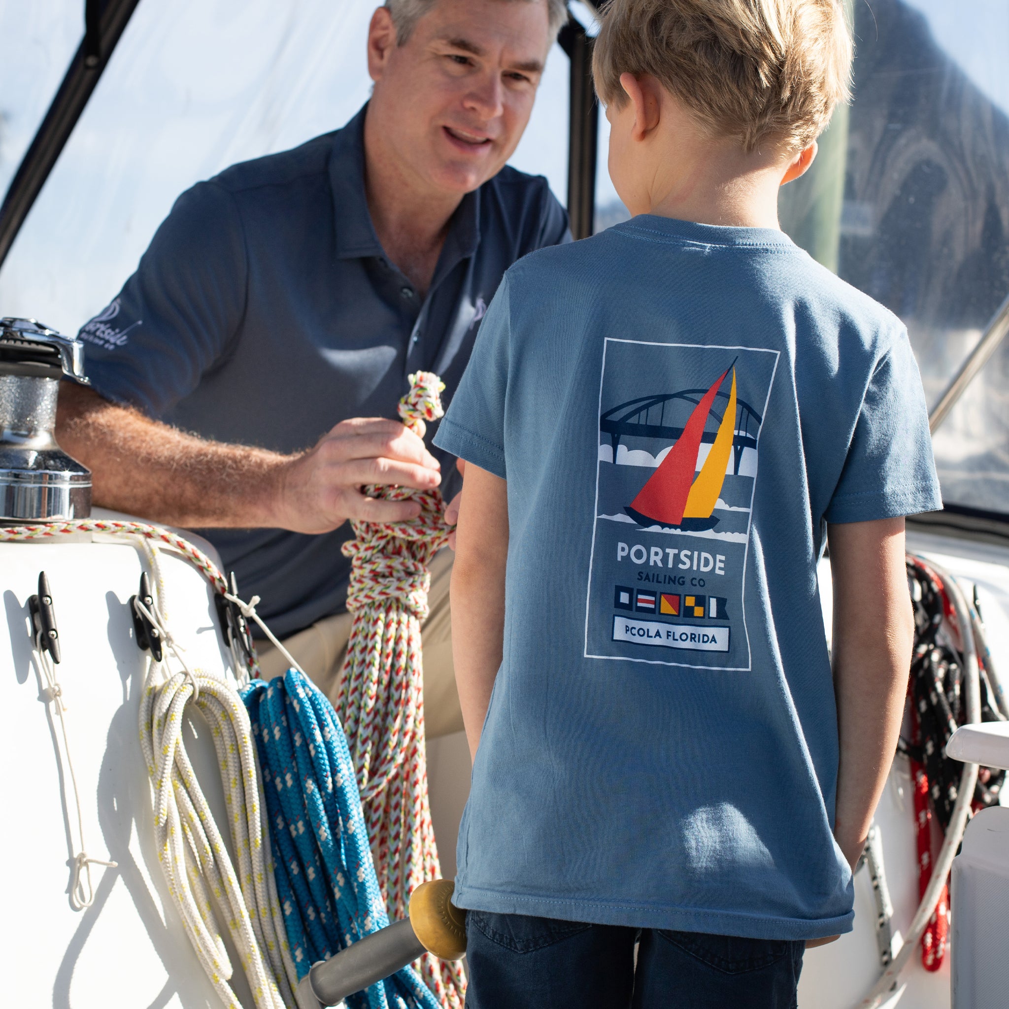 Kids' t-shirt with a colorful graphic of the Pensacola Bay Bridge, offering a stylish and comfortable way for children to celebrate their local scenery.