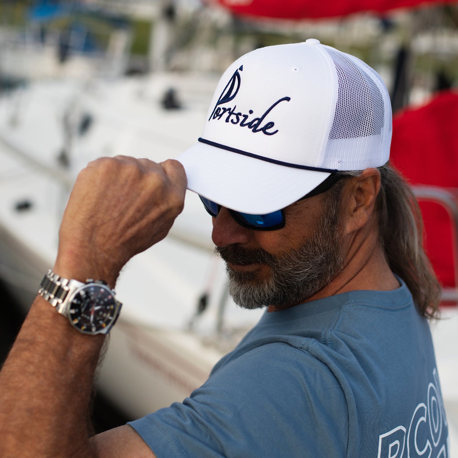Casual Portside Sailing Co. hat with embroidered branding, a perfect accessory for sailing trips or everyday wear.