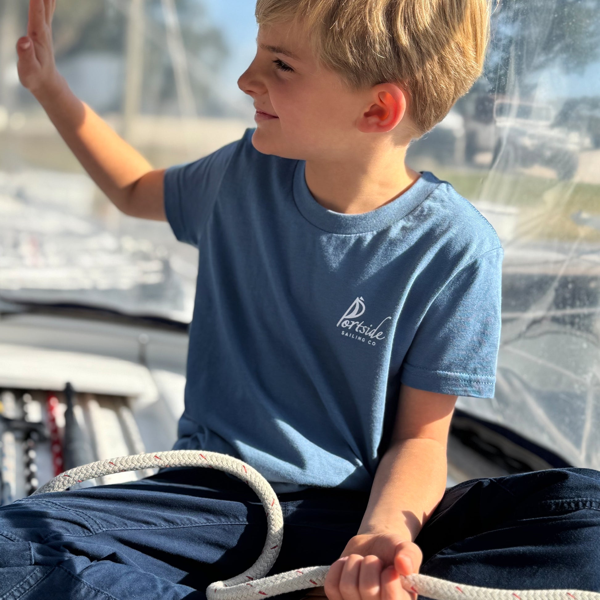Kids' PCOLA t-shirt made with soft fabric, featuring a bold Pensacola design, ideal for kids who love coastal style.